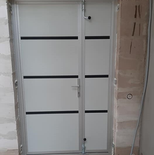 Small size garage doors from the inside in white colour